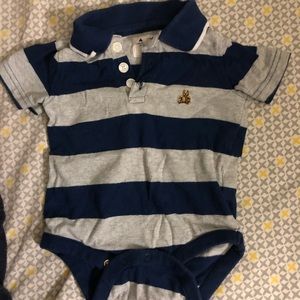 A baby boy blue with grey shirt